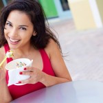 Young Woman Enjoying Frozen Yogurt