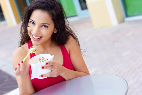 Young Woman Enjoying Frozen Yogurt