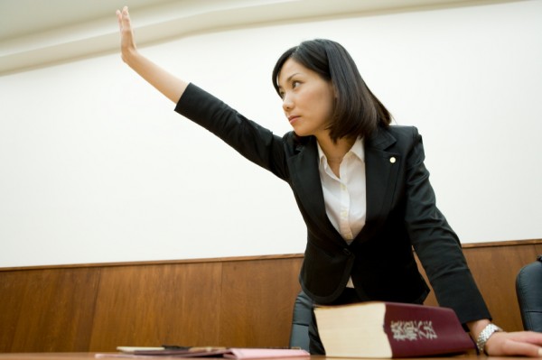 Lawyer raising hand
