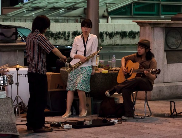 A street band prepares for performance in Osaka Japan.