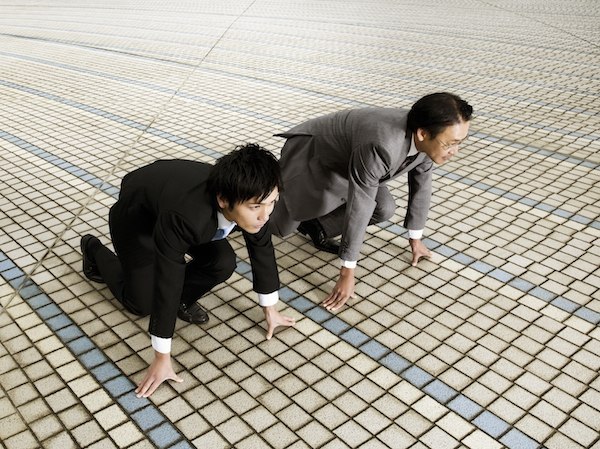 Businessmen Preparing To Race