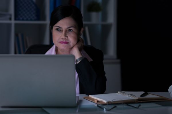 Businesswoman working in the office at night