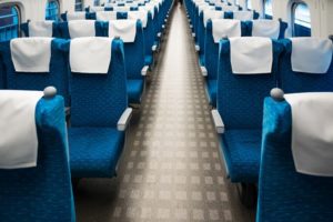 Inside high speed train(Shinkansen), show rows of seats.