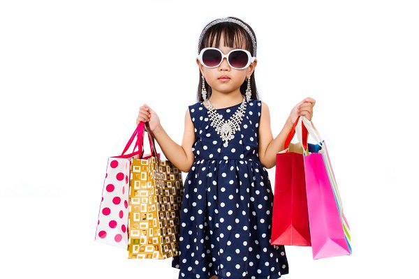 Asian Little Chinese Girl with Shopping Bag isolated on White Background