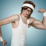 Funny retro nerd with one huge arm flexing his muscle over blue background