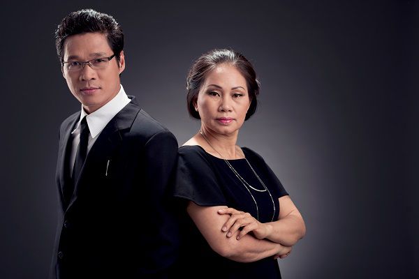 Portrait of confident business team on dark background
