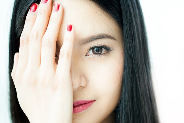 Beautiful Asian woman face in white background - beauty concept