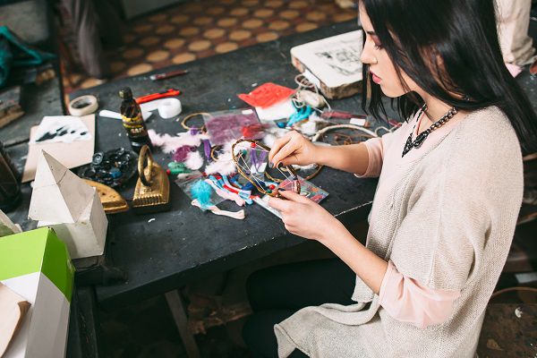 master makes new  Dreamcatcher in art studio.