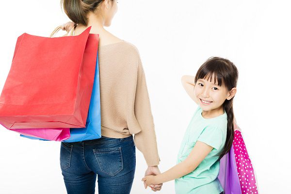 happy little girl shopping with mother