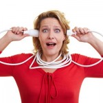 Woman holding an extension cord with both hands