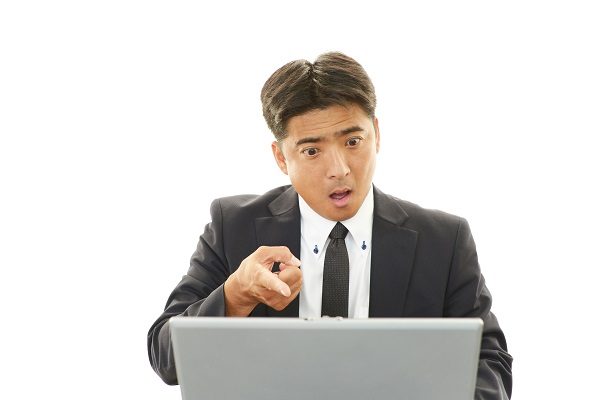 Surprised Asian businessman