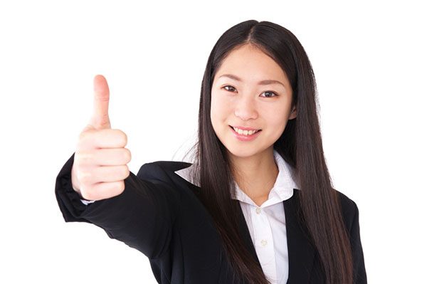 Asian young business woman thumb up gesture