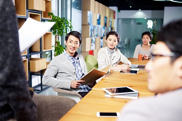 young asian entrepreneurs meeting in office