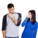 stock-photo-34468644-woman-looking-at-man-who-sniffs-himself